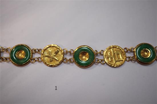 A Chinese gold and jadeite disc link bracelet, 6.75in.